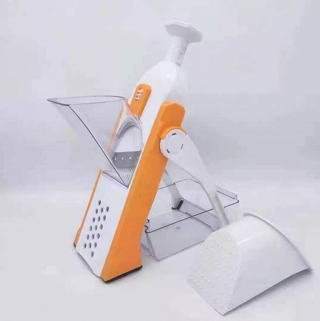 coupe légumes orange, Vegetable slicer Kitchen tool Food preparation Cutting utensil Cooking accessory Kitchen gadget Multi-purpose cutter Vegetable chopper Precision slicing Culinary equipment Chef's tool,